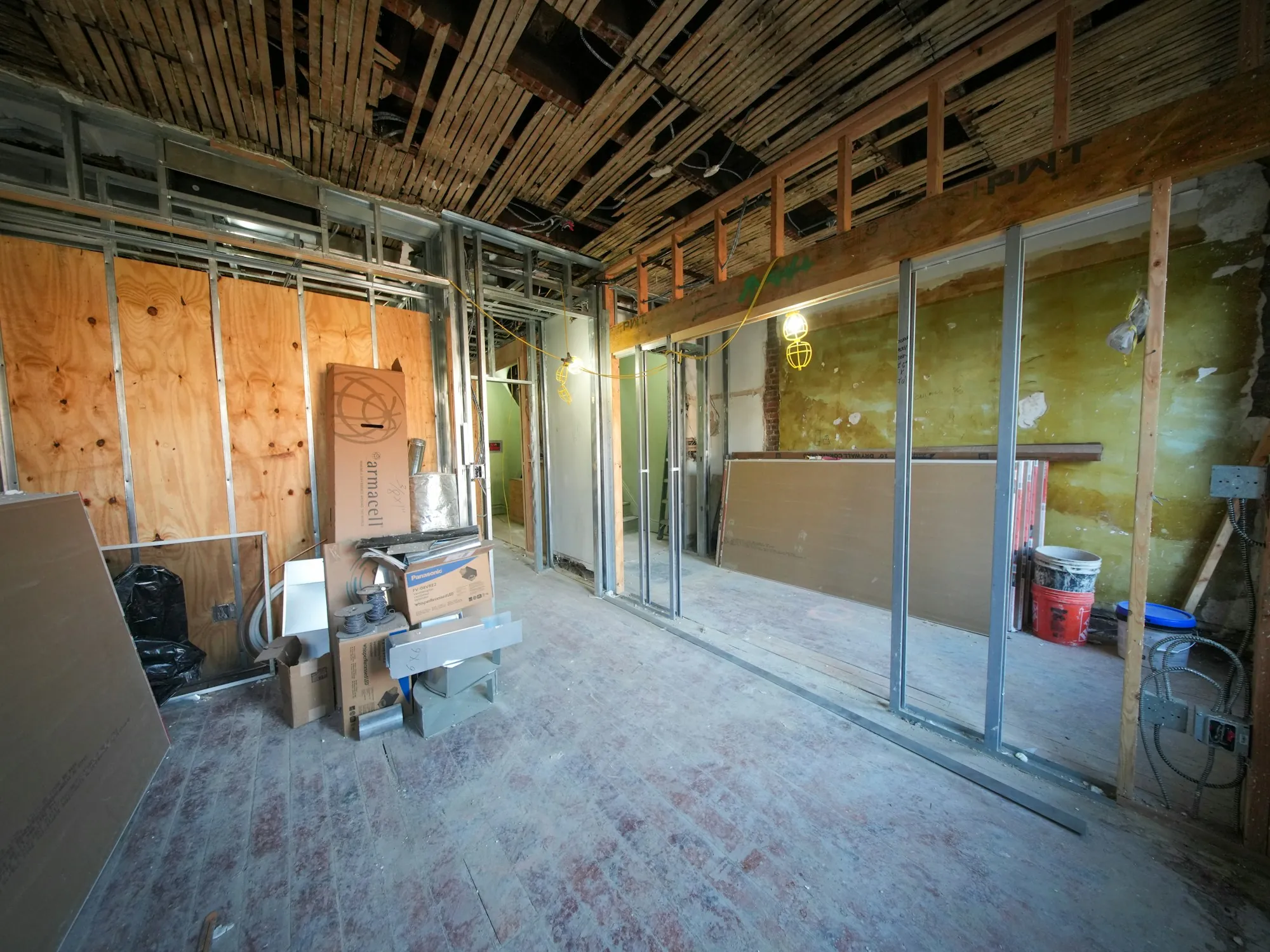 Interior of a building under renovation with exposed framing